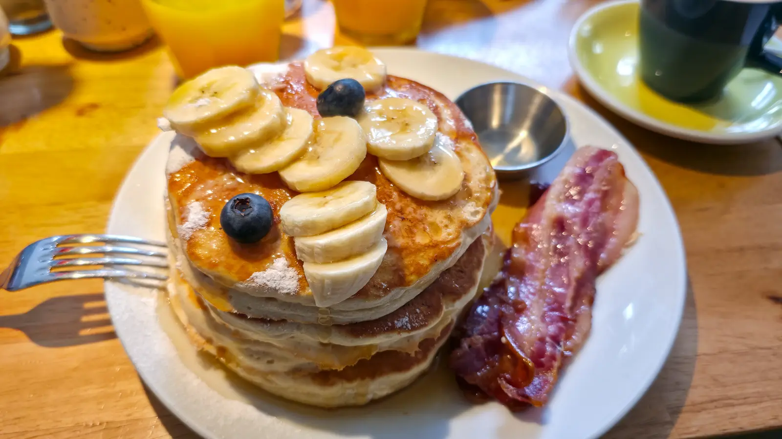 Pancakes with banana, blueberries and bacon at Bakers & Roasters in De Pijp, Amsterdam