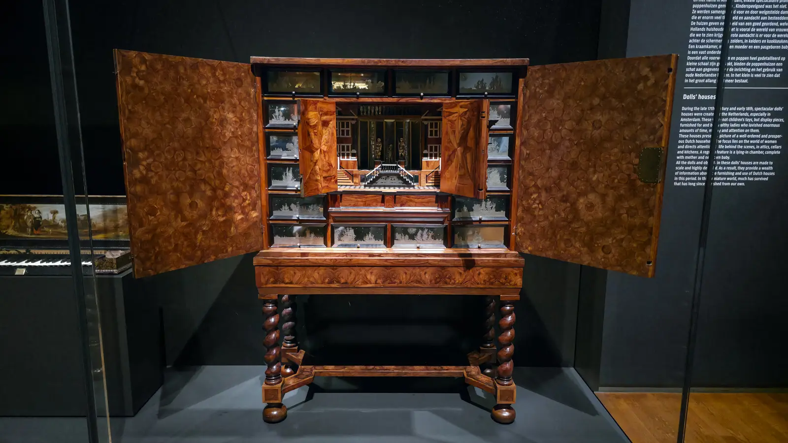 A 17th-century collector's cabinet at the Rijksmuseum, its doors open on small drawers fronted with engraved mirrors