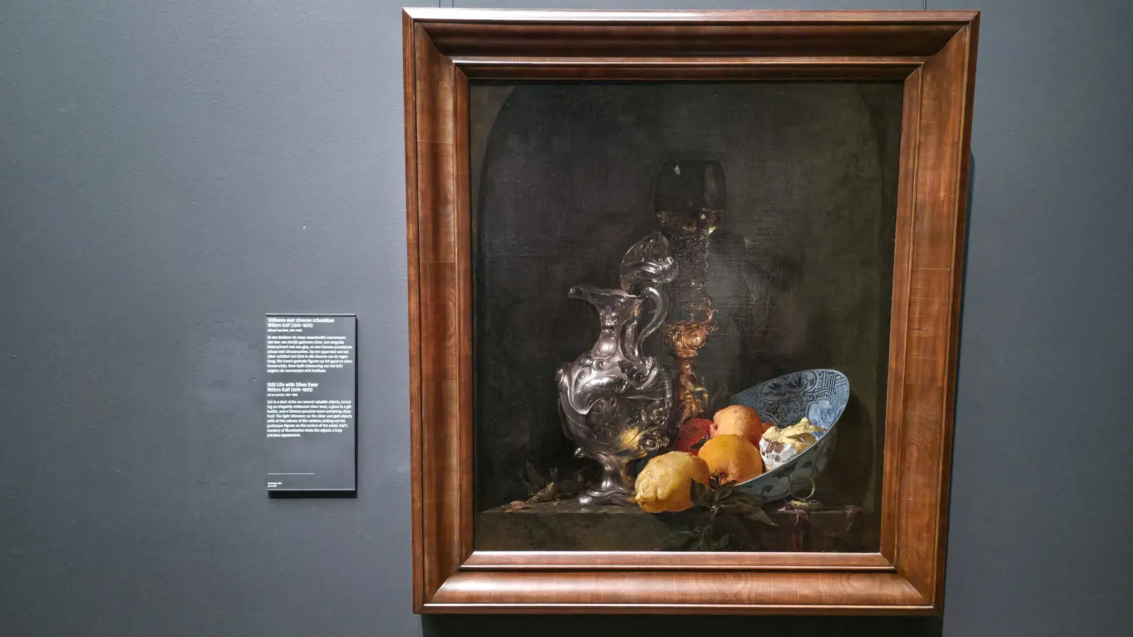 Willem Kalf's silver ewer, gilt glass holder and blue-and-white bowl of citrus fruit in a dark niche, Rijksmuseum Amsterdam