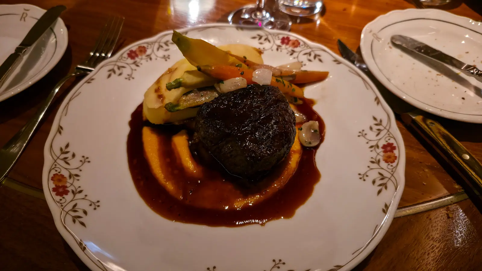 Filet mignon on carrot butter with roasted heirloom carrots, onions and mashed potatoes in a Madeira jus, Reign, Toronto