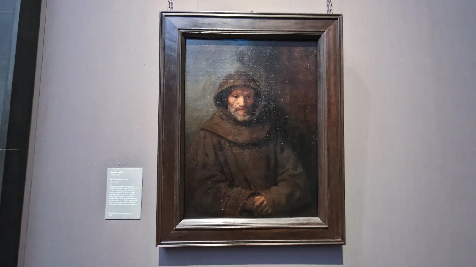 Rembrandt's A Franciscan Friar at the National Gallery, London, an old friar in a brown hooded habit with clasped hands