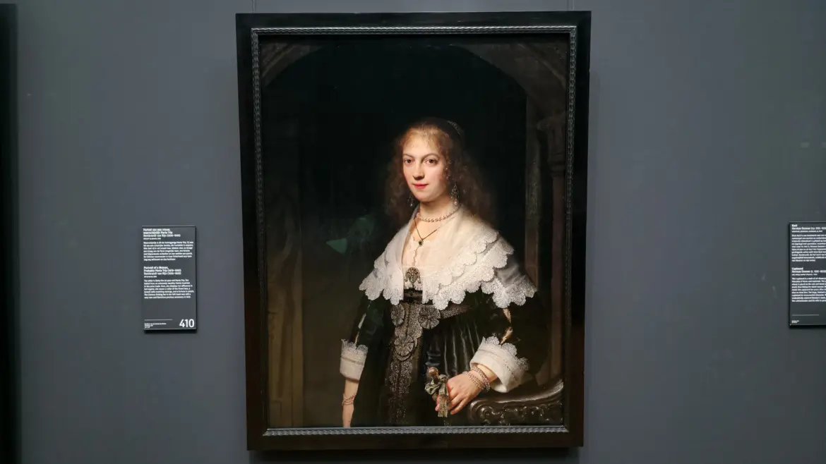 Rembrandt's Portrait of a Woman, probably Maria Trip, in a lace collar and pearls holding a folding fan, at the Rijksmuseum in Amsterdam