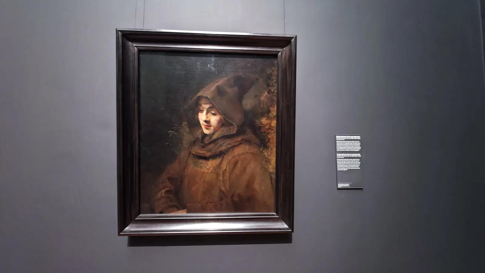 Rembrandt's portrait of his son Titus in a brown monk's habit with a pointed hood, at the Rijksmuseum in Amsterdam