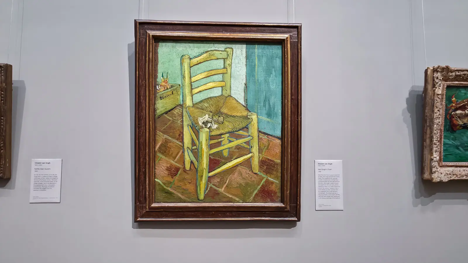 Van Gogh's Chair at the National Gallery, London, a yellow rush-seated chair with a pipe and tobacco on red tiles