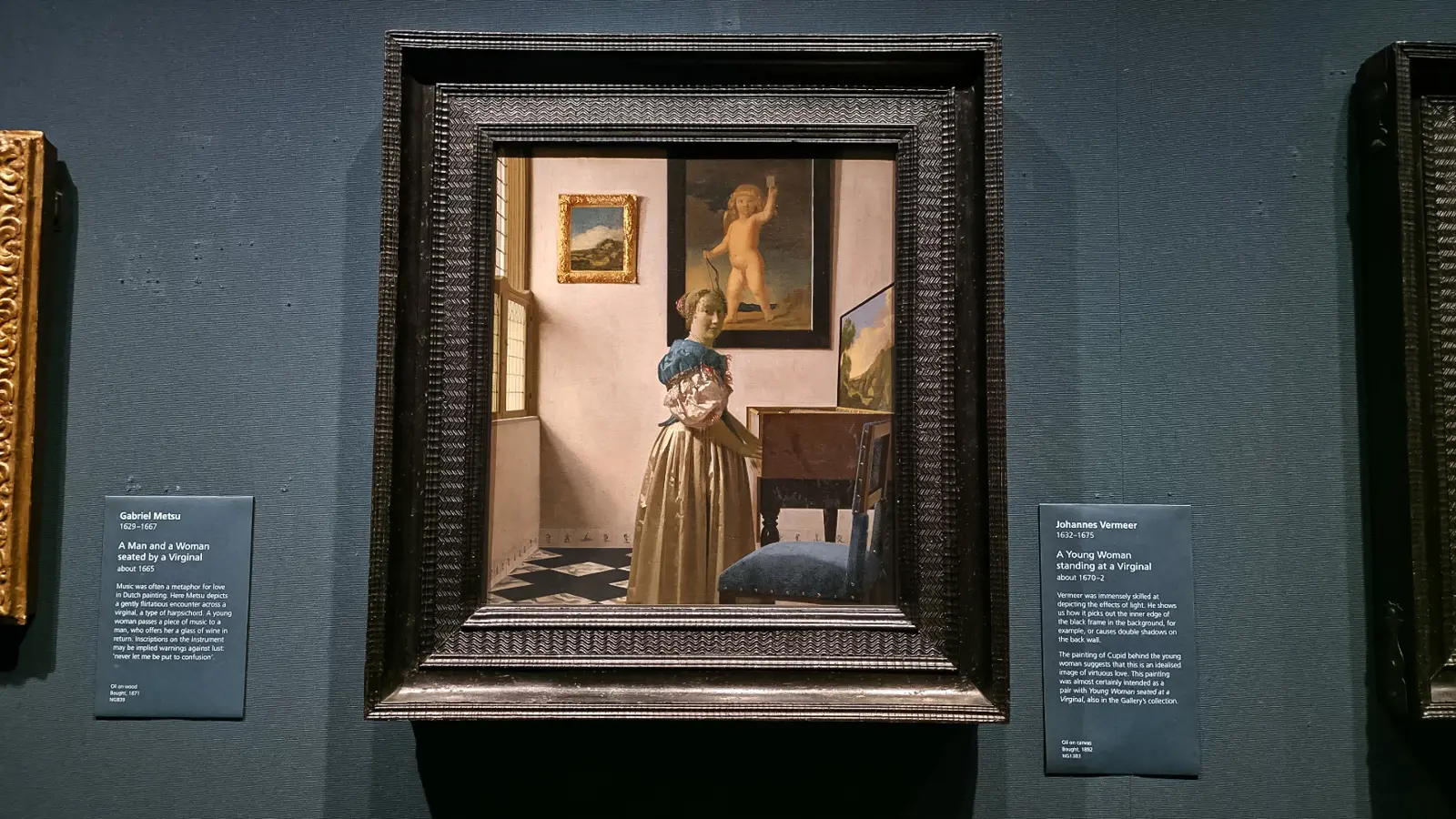 Vermeer's A Young Woman standing at a Virginal at the National Gallery, London, with a painting of Cupid on the wall behind