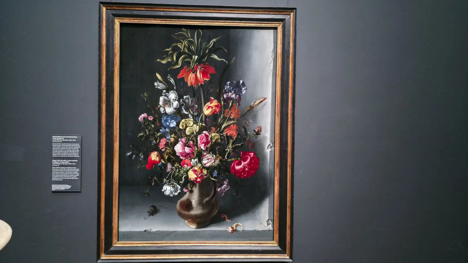 Jacob Vosmaer's flower still life in a stone niche at the Rijksmuseum, a crown imperial above tulips with a mouse at the foot of the jug